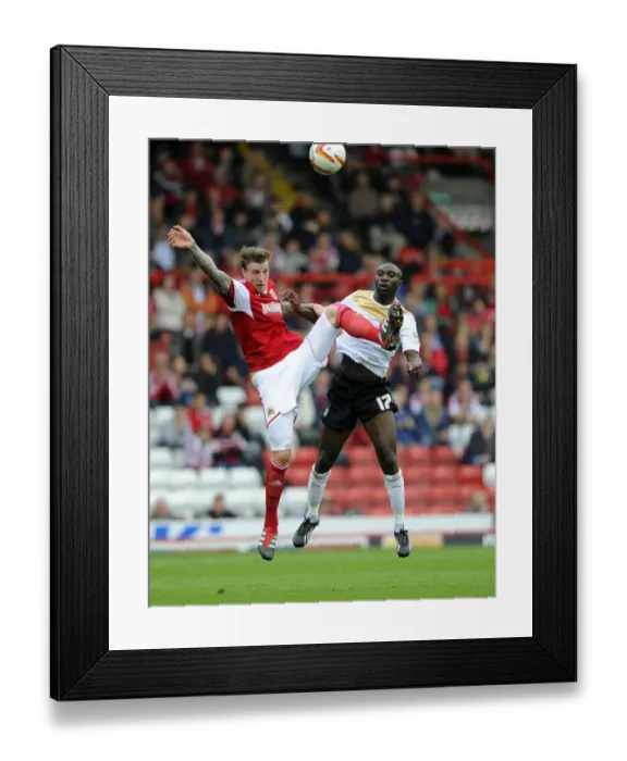 Framed Print : Aden Flint vs Jabo Ibehre: Intense Aerial Battle at Ashton Gate - Bristol City vs Colchester United, Sky Bet League One