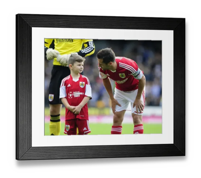 Framed Print : Bristol City's Sam Baldock and Mascot Celebrate Victory at Vale Park