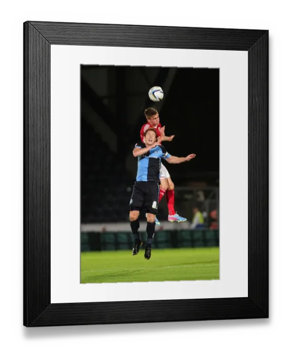 Framed Print : Rivalry Reignites: Bristol City vs Wycombe Wanderers in Johnstone's Paint Trophy Clash at Adams Park (October 8, 2013)