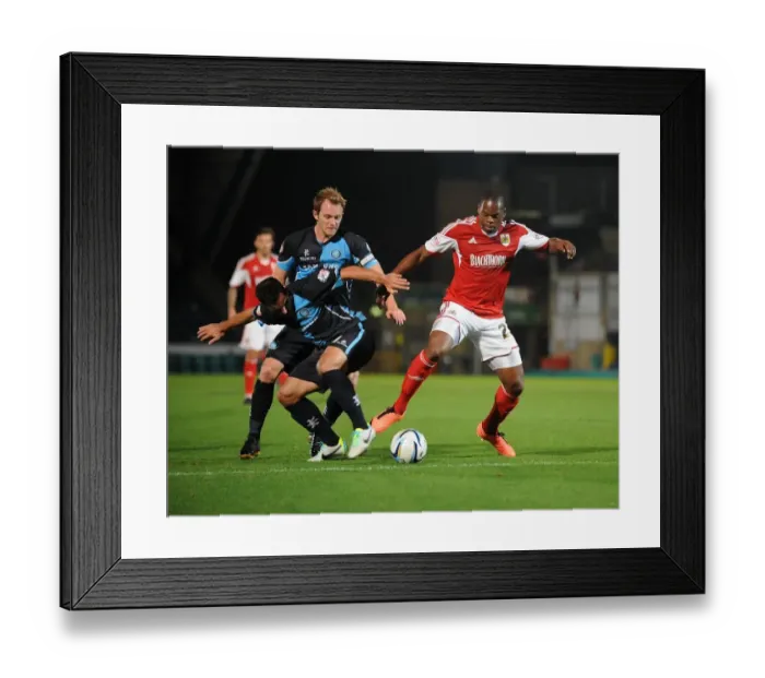 Framed Print : Intense Football Rivalry: Bristol City vs Wycombe Wanderers in the Johnstone's Paint Trophy Clash at Adams Park (October 8, 2013)