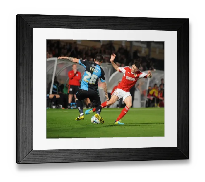 Framed Print : Intense Football Rivalry: Bristol City vs Wycombe Wanderers in the Johnstone's Paint Trophy Clash at Adams Park (October 8, 2013)