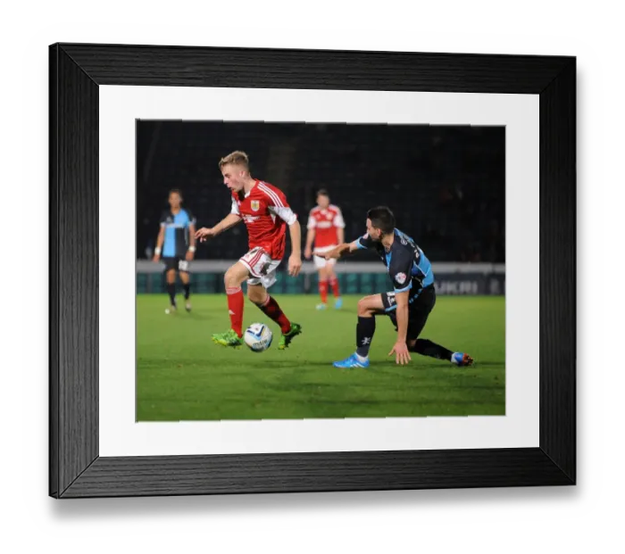 Framed Print : Intense Football Rivalry: Bristol City vs Wycombe Wanderers in the Johnstone's Paint Trophy Clash at Adams Park (October 8, 2013)
