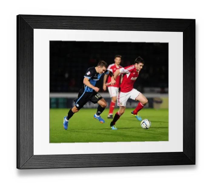 Framed Print : Intense Rivalry: Bristol City vs Wycombe Wanderers in the Johnstone's Paint Trophy Clash at Adams Park (October 8, 2013)