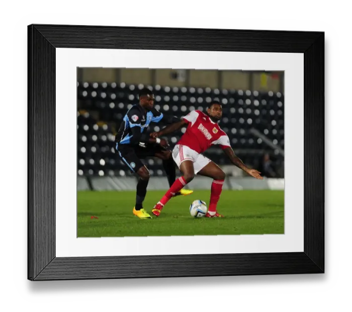 Framed Print : Bristol City vs Wycombe Wanderers: Intense Football Rivalry in the Johnstone's Paint Trophy Clash at Adams Park (October 8, 2013)