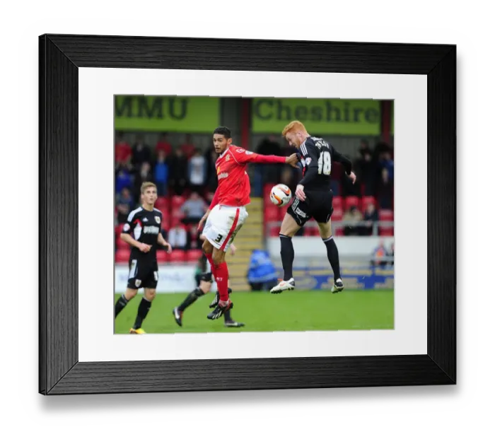 Framed Print : Intense Rivalry: A Leap for Supremacy - Mellor vs. Taylor in Crewe vs. Bristol City Football Match
