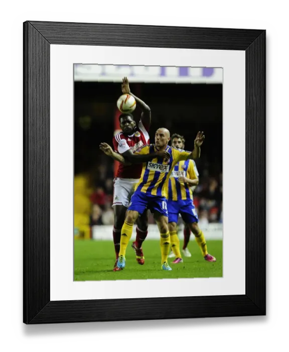Framed Print : Bristol City vs Brentford: Emmanuel-Thomas vs McCormack - Intense Battle for Possession Framed Print : Bristol City vs Brentford: Emmanuel-Thomas vs McCormack - Intense Battle for Possession
