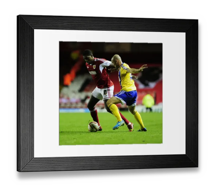 Framed Print : Bristol City vs Brentford: Jay Emmanuel-Thomas vs Alan McCormack - Intense Football Action