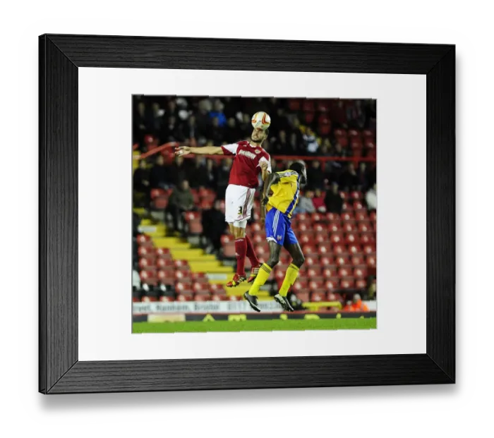 Framed Print : Bristol City vs Brentford: Intense Header Battle Between Derrick Williams and Clayton Donaldson Framed Print : Bristol City vs Brentford: Intense Header Battle Between Derrick Williams and Clayton Donaldson