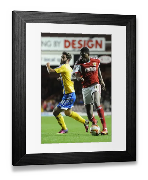 Framed Print : Bristol City's Jay Emmanuel-Thomas Outmaneuvers Brentford's Will Grigg in Sky Bet League One Clash Framed Print : Bristol City's Jay Emmanuel-Thomas Outmaneuvers Brentford's Will Grigg in Sky Bet League One Clash