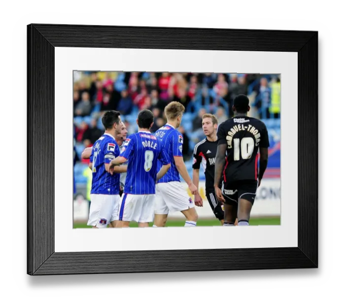 Framed Print : Intense Rivalry: Wagstaff vs. Potts Clash at Brunton Park - Football's Heated Moment between Scott Wagstaff and Brad Potts