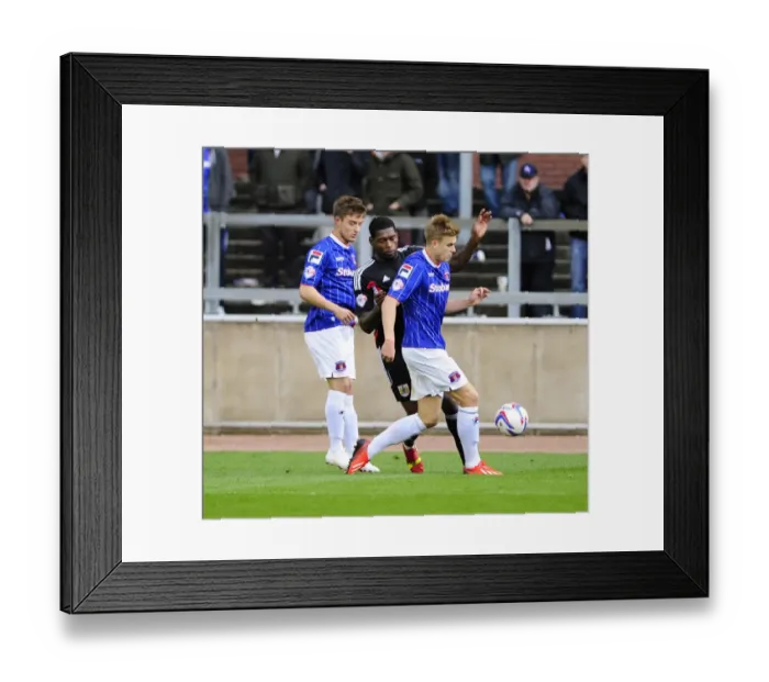 Framed Print : Jay Emmanuel-Thomas vs Brad Potts: Intense Moment in Carlisle United vs Bristol City Football Match, October 2013