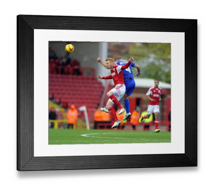 Framed Print : Bristol City vs Oldham Athletic: Intense Aerial Battle Between Ryan Taylor and James Wesolowski Framed Print : Bristol City vs Oldham Athletic: Intense Aerial Battle Between Ryan Taylor and James Wesolowski