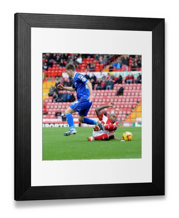 Framed Print : Intense Tackle: Marvin Elliott vs Daniel Philliskirk in Sky Bet League One Clash Framed Print : Intense Tackle: Marvin Elliott vs Daniel Philliskirk in Sky Bet League One Clash