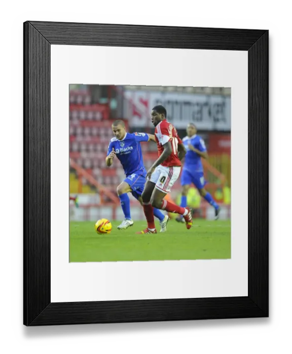 Framed Print : Bristol City's Jay Emmanuel-Thomas Outmaneuvers Oldham Athletic's James Wesolowski in Sky Bet League One Clash Framed Print : Bristol City's Jay Emmanuel-Thomas Outmaneuvers Oldham Athletic's James Wesolowski in Sky Bet League One Clash