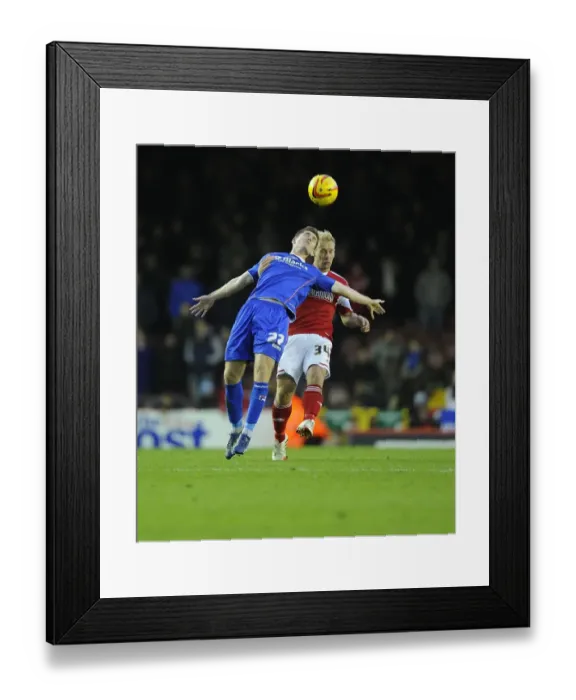 Framed Print : Battling for Supremacy: Simon Gillett vs. Daniel Philliskirk in Bristol City vs. Oldham Athletic Football Match, Sky Bet League One, 2013