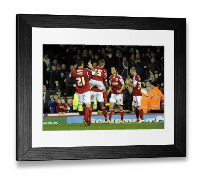 Framed Print : Bristol City: Jay Emmanuel-Thomas Scores and Celebrates with Team Mates at Ashton Gate