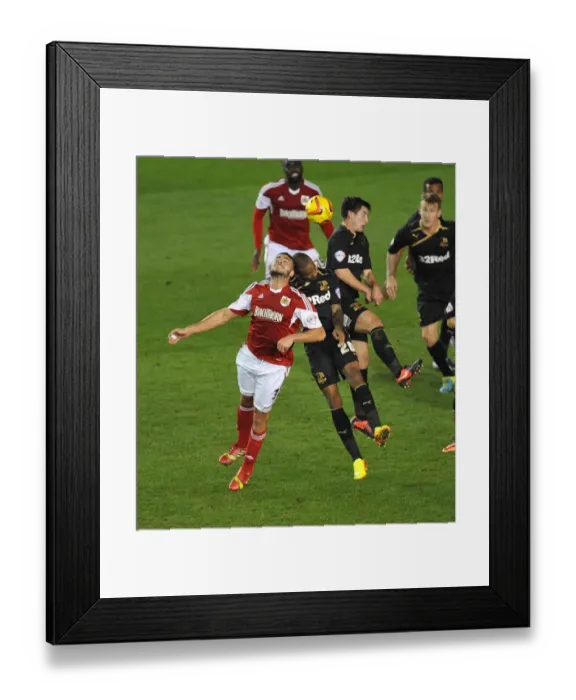 Framed Print : Bristol City vs Crawley Town: Intense Aerial Battle Between Derrick Williams and Emile Sinclair