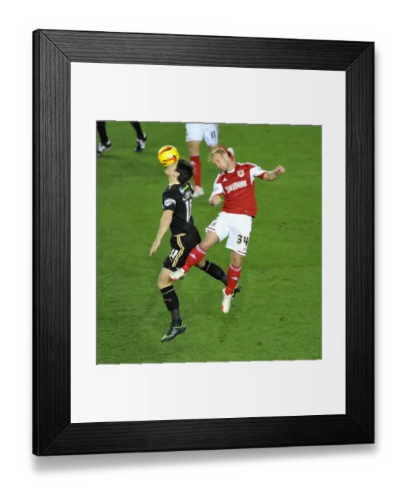 Framed Print : Bristol City's Simon Gillett and Crawley Town's Josh Simpson Battle for High Ball in Cardiff City vs Swansea City Match Framed Print : Bristol City's Simon Gillett and Crawley Town's Josh Simpson Battle for High Ball in Cardiff City vs Swansea City Match