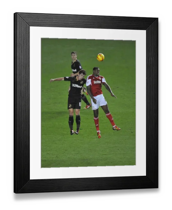 Framed Print : Bristol City's Jay Emmanuel-Thomas Soars Above Crawley Town's Joe Walsh in Intense Football Clash Framed Print : Bristol City's Jay Emmanuel-Thomas Soars Above Crawley Town's Joe Walsh in Intense Football Clash
