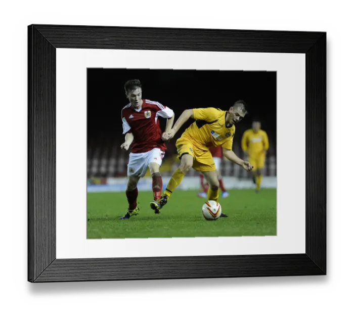 Framed Print : Tense Rivalry: Young Stars Clash in Bristol City U18s vs Newport County U18s Football Match - Jamie Horgan vs Lewis Holmes