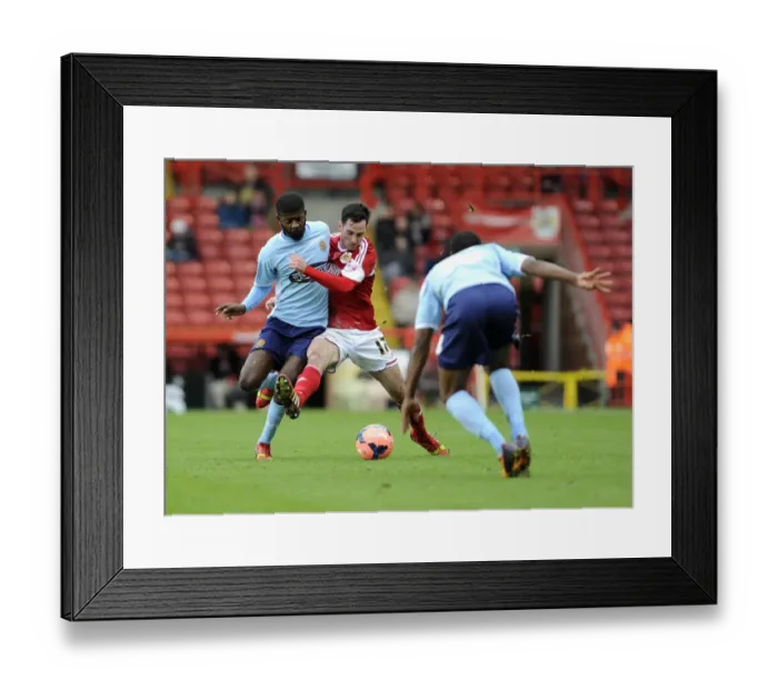 Framed Print : Bristol City's Greg Cunningham Fends Off Medy Elito in FA Cup Clash vs Dagenham and Redbridge Framed Print : Bristol City's Greg Cunningham Fends Off Medy Elito in FA Cup Clash vs Dagenham and Redbridge