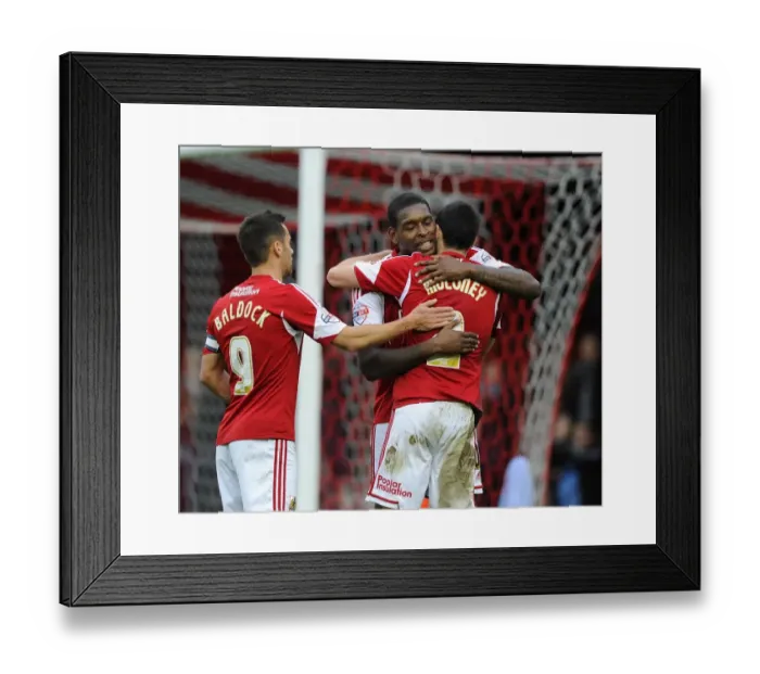 Framed Print : Bristol City's Triumph: Emmanuel-Thomas, Moloney, and Baldock's Euphoric Moment after FA Cup Goal vs. Dagenham and Redbridge Framed Print : Bristol City's Triumph: Emmanuel-Thomas, Moloney, and Baldock's Euphoric Moment after FA Cup Goal vs. Dagenham and Redbridge