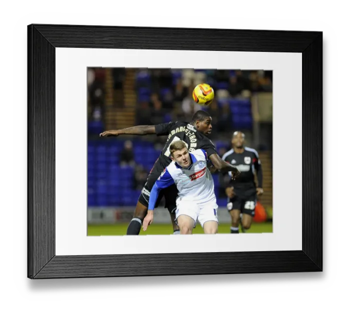 Framed Print : Bristol City's Jay Emmanuel-Thomas Fights for the Header in Tranmere vs. Bristol City Football Match, Sky Bet League One (November 16, 2013)