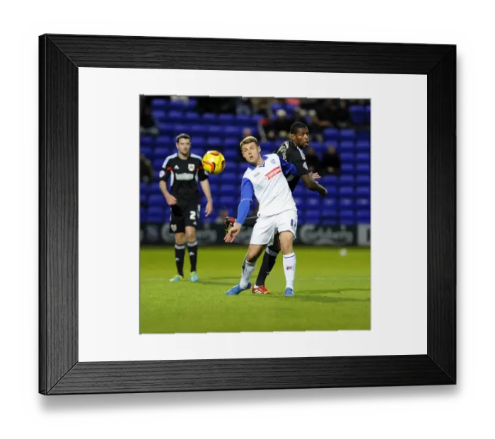Framed Print : Bristol City's Jay Emmanuel-Thomas vs Tranmere's Max Power in Sky Bet League One Clash at Prenton Park Framed Print : Bristol City's Jay Emmanuel-Thomas vs Tranmere's Max Power in Sky Bet League One Clash at Prenton Park