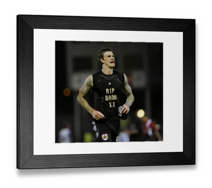 Framed Print : Aden Flint Honors Nana with RIP Shirt during Tranmere vs. Bristol City Match (November 2013) Framed Print : Aden Flint Honors Nana with RIP Shirt during Tranmere vs. Bristol City Match (November 2013)