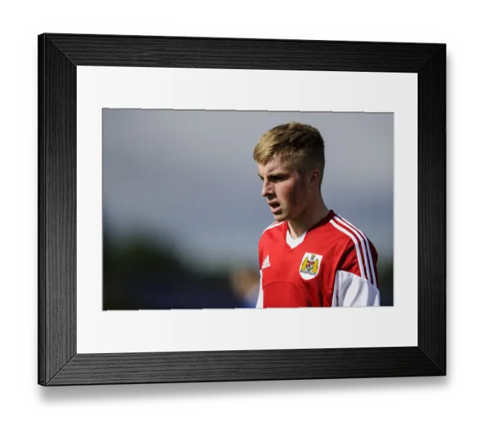 Framed Print : Joe Morrell's Intense Concentration: U18 Clash Between Bristol City and Brighton & Hove Albion at SGS Wise Campus (October 2013)