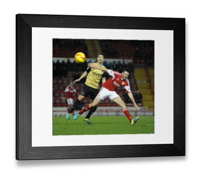 Framed Print : Intense Rivalry: Moloney vs. James - A Football Battle for the Ball