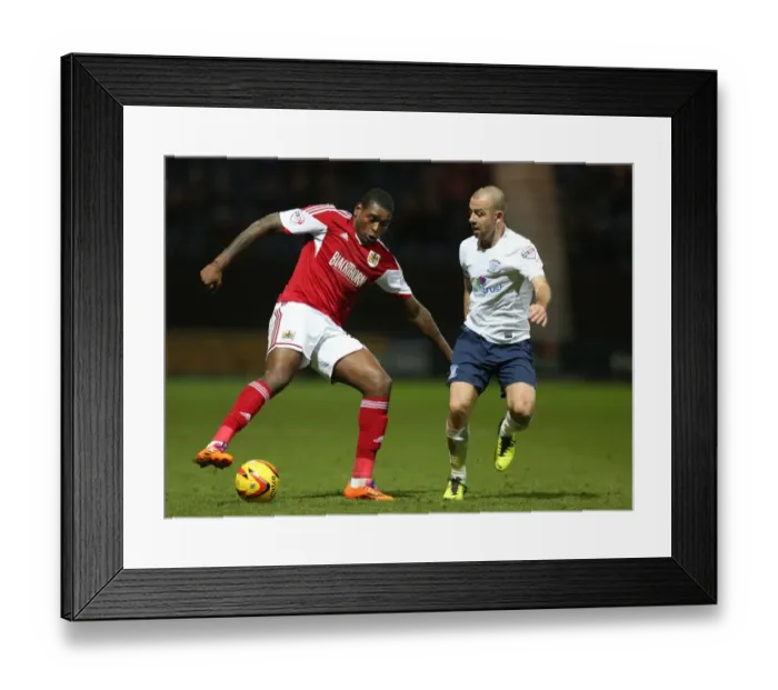 Framed Print : Bristol City's Jay Emmanuel-Thomas vs. Preston North End's Keith Keane - Intense Battle on the Field