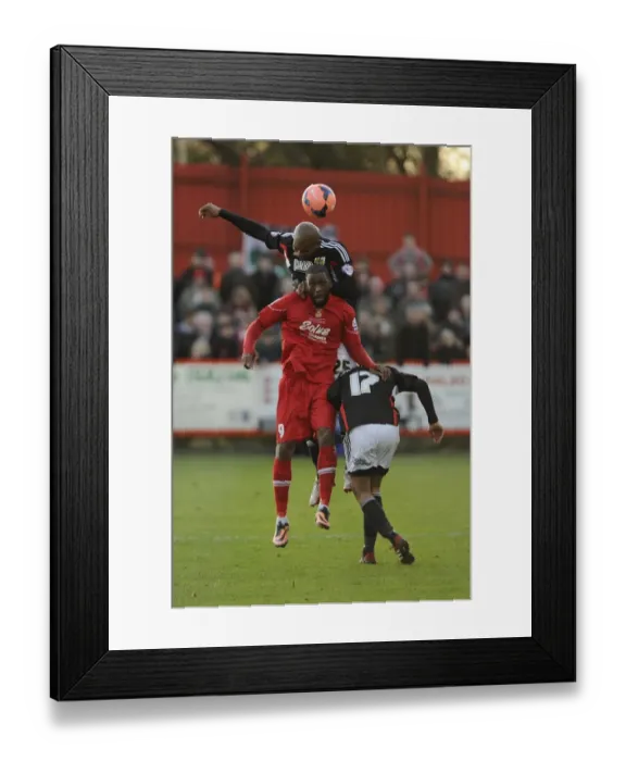 Framed Print : Marvin Elliott vs. Justin Richards: Aerial Battle in FA Cup Match between Tamworth and Bristol City