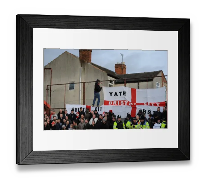 Framed Print : Bristol City Fan Hoists Flag at Tamworth's The Lamb Ground during FA Cup Match Framed Print : Bristol City Fan Hoists Flag at Tamworth's The Lamb Ground during FA Cup Match