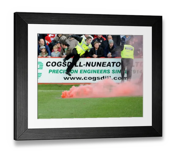 Framed Print : FA Cup: Disruptive Fan Behavior at Tamworth v Bristol City - Stewards Intervene to Remove Flare Throne from Pitch