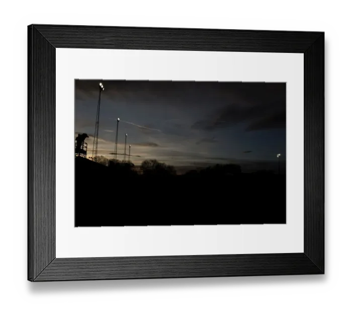 Framed Print : FA Cup Sunset: Tamworth vs. Bristol City at The Lamb Ground - ITV Camera Man and Floodlights Silhouetted Amidst Setting Sun Framed Print : FA Cup Sunset: Tamworth vs. Bristol City at The Lamb Ground - ITV Camera Man and Floodlights Silhouetted Amidst Setting Sun