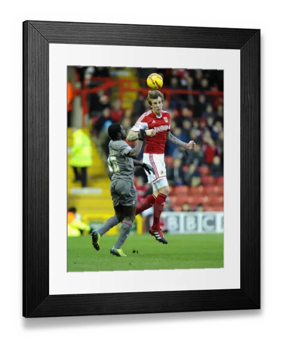 Framed Print : Football Rivalry in Sky Bet League One: Aden Flint vs Nouha Dicko's Aerial Battle Framed Print : Football Rivalry in Sky Bet League One: Aden Flint vs Nouha Dicko's Aerial Battle