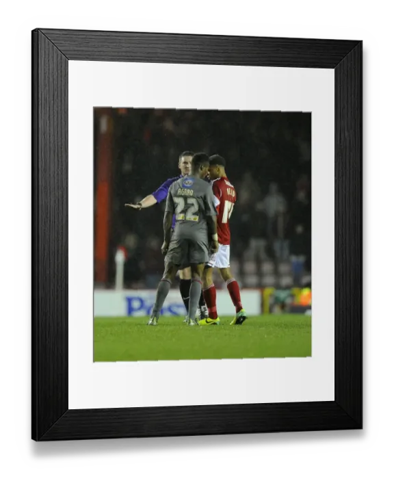 Framed Print : Controversial Moment: Kieran Agard Escapes Punishment for Heading into Bobby Reid's Challenge in Bristol City vs Rotherham United Framed Print : Controversial Moment: Kieran Agard Escapes Punishment for Heading into Bobby Reid's Challenge in Bristol City vs Rotherham United