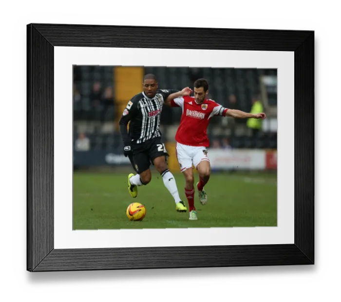 Framed Print : Battling for Supremacy: Sam Baldock vs. Andre Boucaud in Notts County vs. Bristol City Football Match, December 2013