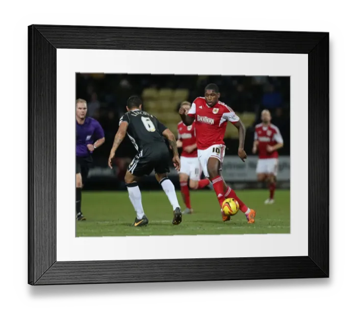 Framed Print : Bristol City's Jay Emmanuel-Thomas Charges Forward Against Notts County's Dean Leacock in Sky Bet League One Clash Framed Print : Bristol City's Jay Emmanuel-Thomas Charges Forward Against Notts County's Dean Leacock in Sky Bet League One Clash