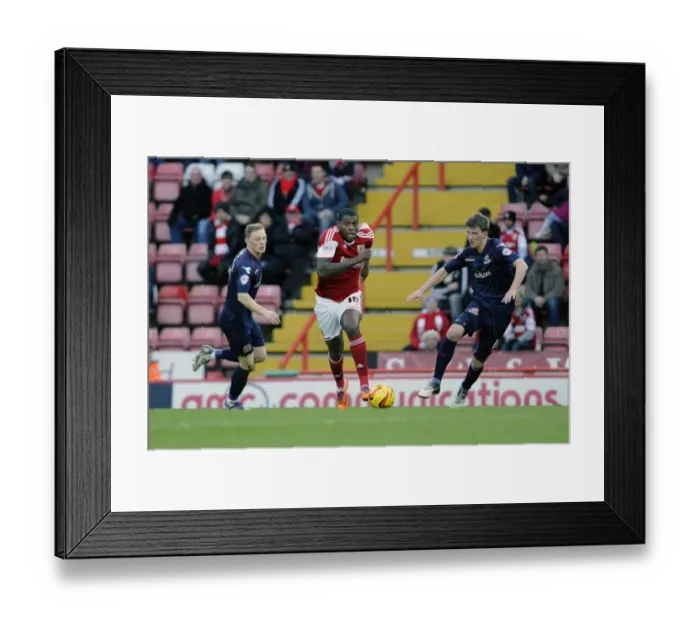 Framed Print : Jay Emmanuel-Thomas Dashes Past Defenders in Bristol City's Victory over Walsall