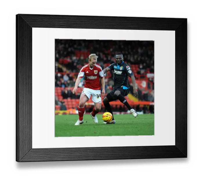 Framed Print : Bristol City vs Stevenage: Intense Moment as Francois Zoko Challenges Simon Gillett
