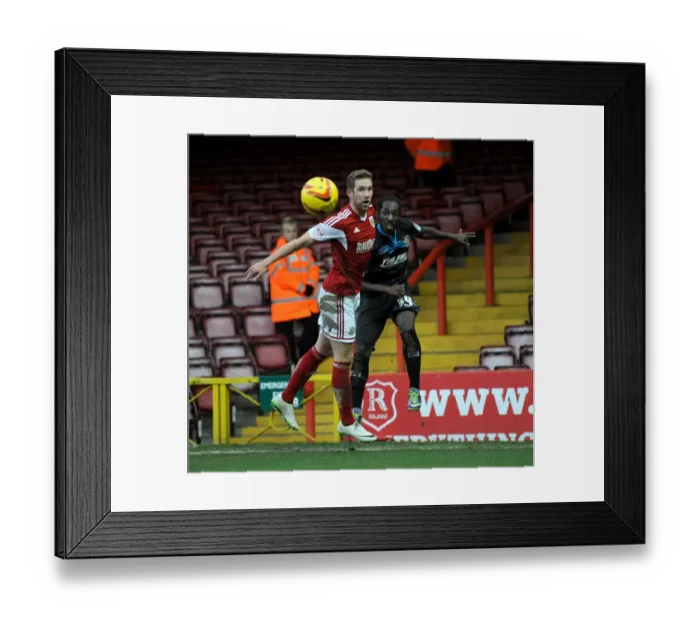 Framed Print : Bristol City vs Stevenage: Roarie Deacon Clears Under Pressure from Scott Wagstaff