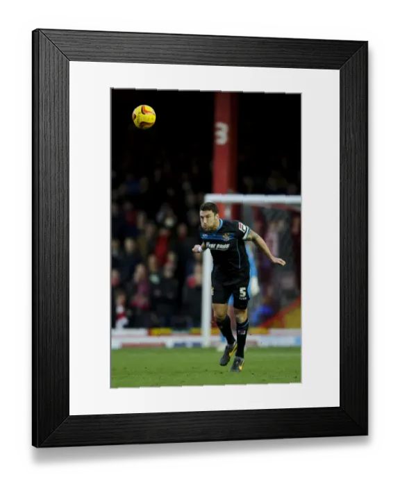 Framed Print : Bristol City vs Stevenage: Jon Ashton Heads the Ball in Sky Bet League One Clash