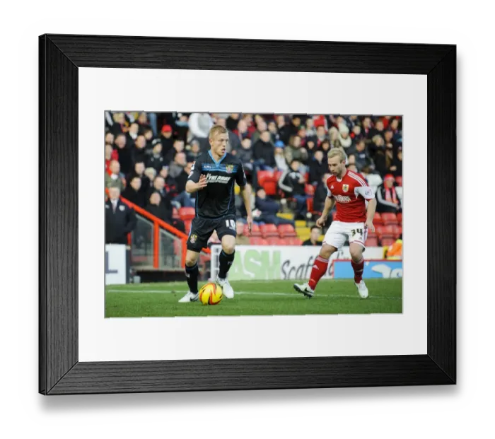 Framed Print : Bristol City vs Stevenage: Intense Mid-Match Battle Between Jordan Burrow and Simon Gillett Framed Print : Bristol City vs Stevenage: Intense Mid-Match Battle Between Jordan Burrow and Simon Gillett