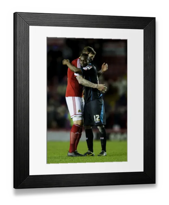 Framed Print : Aden Flint Consoles Disappointed Francois Zoko After Bristol City's 4-1 Victory