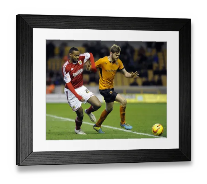 Framed Print : Tyrone Barnett Goes Head-to-Head with Wolverhampton Wanderers in Sky Bet League One Clash Framed Print : Tyrone Barnett Goes Head-to-Head with Wolverhampton Wanderers in Sky Bet League One Clash