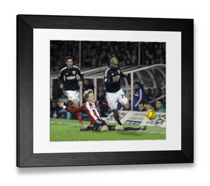 Framed Print : Brentford vs. Bristol City: Marvin Elliott Tackled by George Saville Framed Print : Brentford vs. Bristol City: Marvin Elliott Tackled by George Saville
