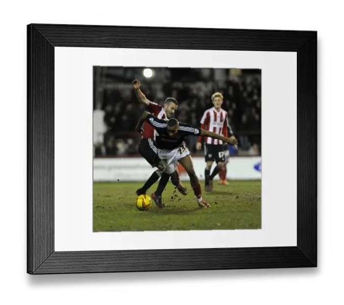 Framed Print : Bristol City's Tyrone Barnett Evades Brentford's Kevin O'Connor during Sky Bet League One Clash Framed Print : Bristol City's Tyrone Barnett Evades Brentford's Kevin O'Connor during Sky Bet League One Clash