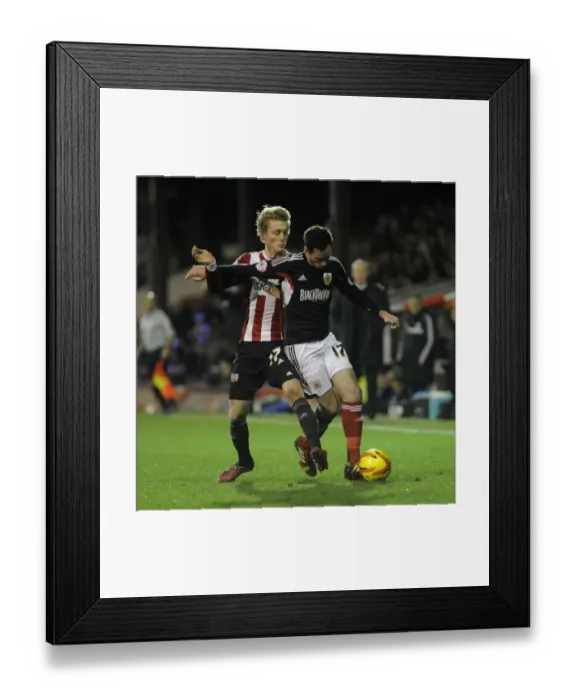 Framed Print : Brentford vs. Bristol City: Intense Battle Between George Saville and Greg Cunningham